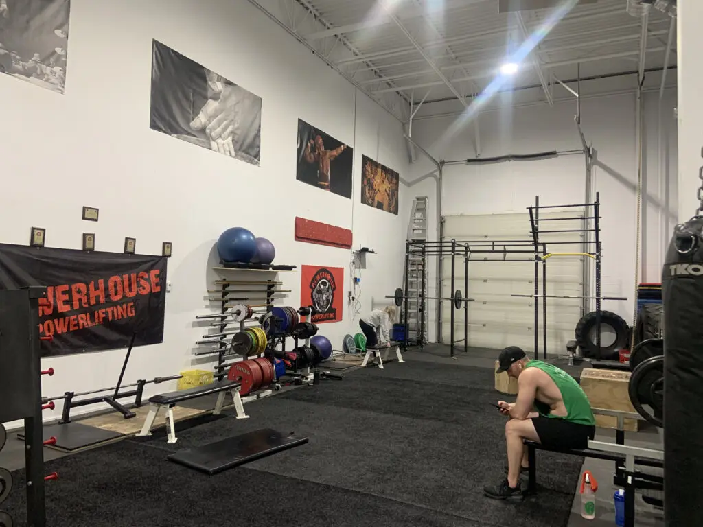 Training floor with turf and racks